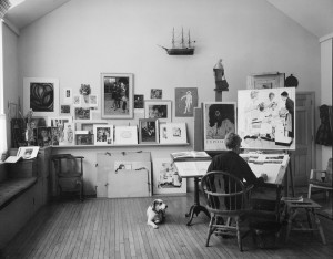 Photo of Norman Rockwell working on “First Trip to the Beauty Parlor” with dog Pitter in his Stockbridge studio, 1972. Photo by Bill Scovill. Norman Rockwell Museum Collections. ©NRELC: Niles, IL.