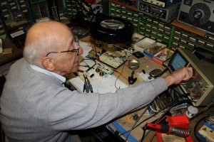 At age 89, Ralph H. Baer is as ever busy as ever. Here, he tinkers away in his Manchester, New Hampshire laboratory/home. Photo by Norman Rockwell Museum. All rights reserved.